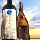 Hybrid Fluid Realism painting by Monica Marquez Gatica featuring Opus One and Corton Charlemagne Grand Cru bottles against a twilight landscape.
