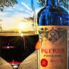 Hybrid Fluid Realism painting by Monica Marquez Gatica featuring a Petrus Pomerol wine bottle with a vivid sunset backdrop.