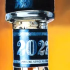 Hyper-realistic oil painting detail of LAWS Whiskey bottle cap from 'The Art of LAWS Intention