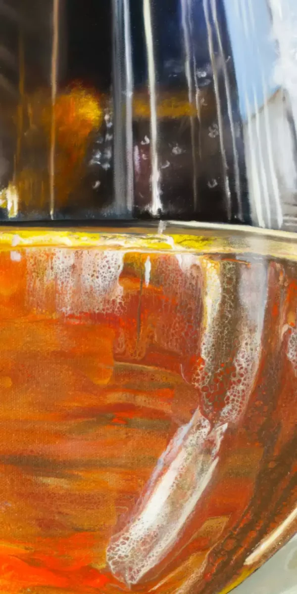Close-up detail of a glass of sherry showing vibrant amber tones and intricate reflections