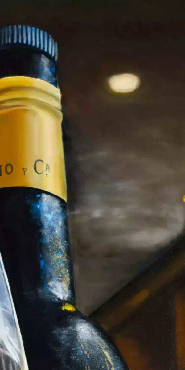 Close-up of the neck and label of a bottle of Cayetano del Pino Palo Cortado Solera against a warm background.
