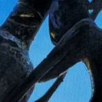 Close-up of a silhouette of a wine bottle and a sculpture, framed against a vibrant blue sky in the background.