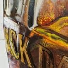 Detailed close-up of Jack Daniel's label lettering and textured background, blending oil and acrylic techniques.