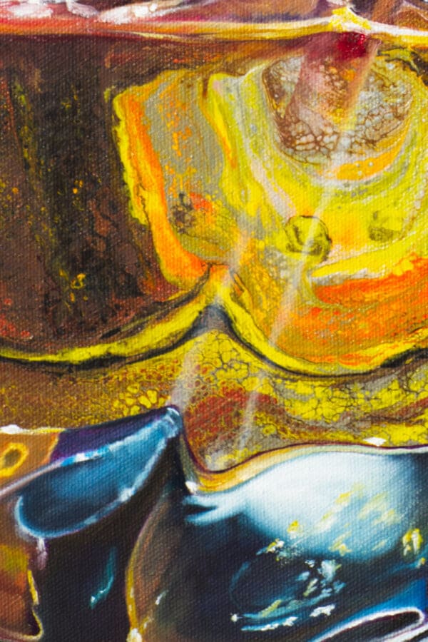 Close-up of vibrant acrylic pouring patterns from the painting "Spirit of the Soar," featuring gold, orange, and blue hues blending organically.