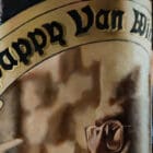 A close-up of the Pappy Van Winkle label, featuring the iconic portrait of Julian Van Winkle Sr. enjoying a cigar.