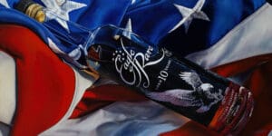 A hyper-realistic painting of an Eagle Rare 10-Year Bourbon bottle resting on an American flag, symbolizing tradition, craftsmanship, and the pursuit of excellence.